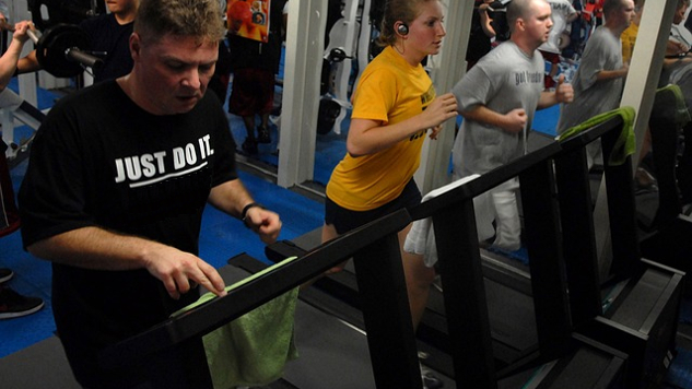 people working out on treadmills in a gym