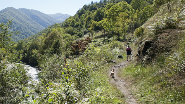 man hiking up mountain path