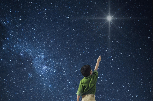 Young boy reaching for the North Star. Image by Lothar Dieterich from Pixabay.&nbsp;