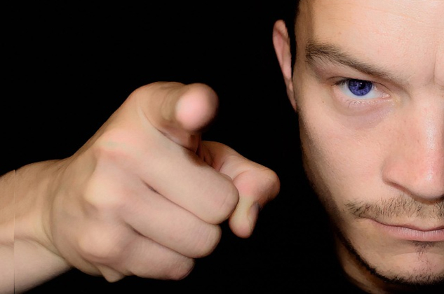 A man up close and pointing a finger at someone. Image by PublicDomainPictures from Pixabay.&nbsp;
