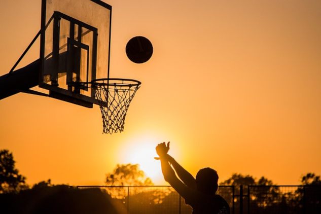Someone shooting a basketball into the basket.&nbsp;Image by Varun Kulkarni from Pixabay.&nbsp;